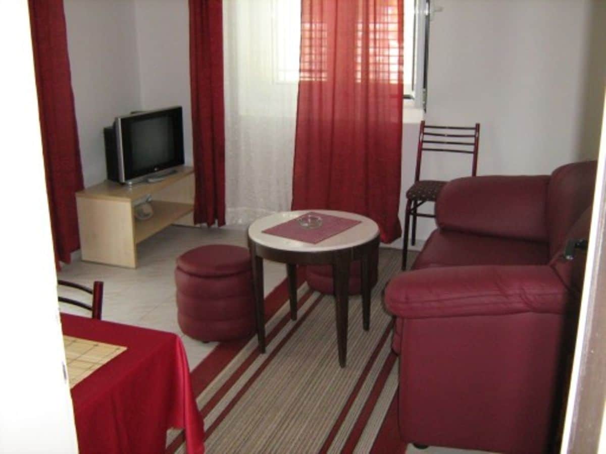 Crimson bedroom Montenegro Apartments Sptings